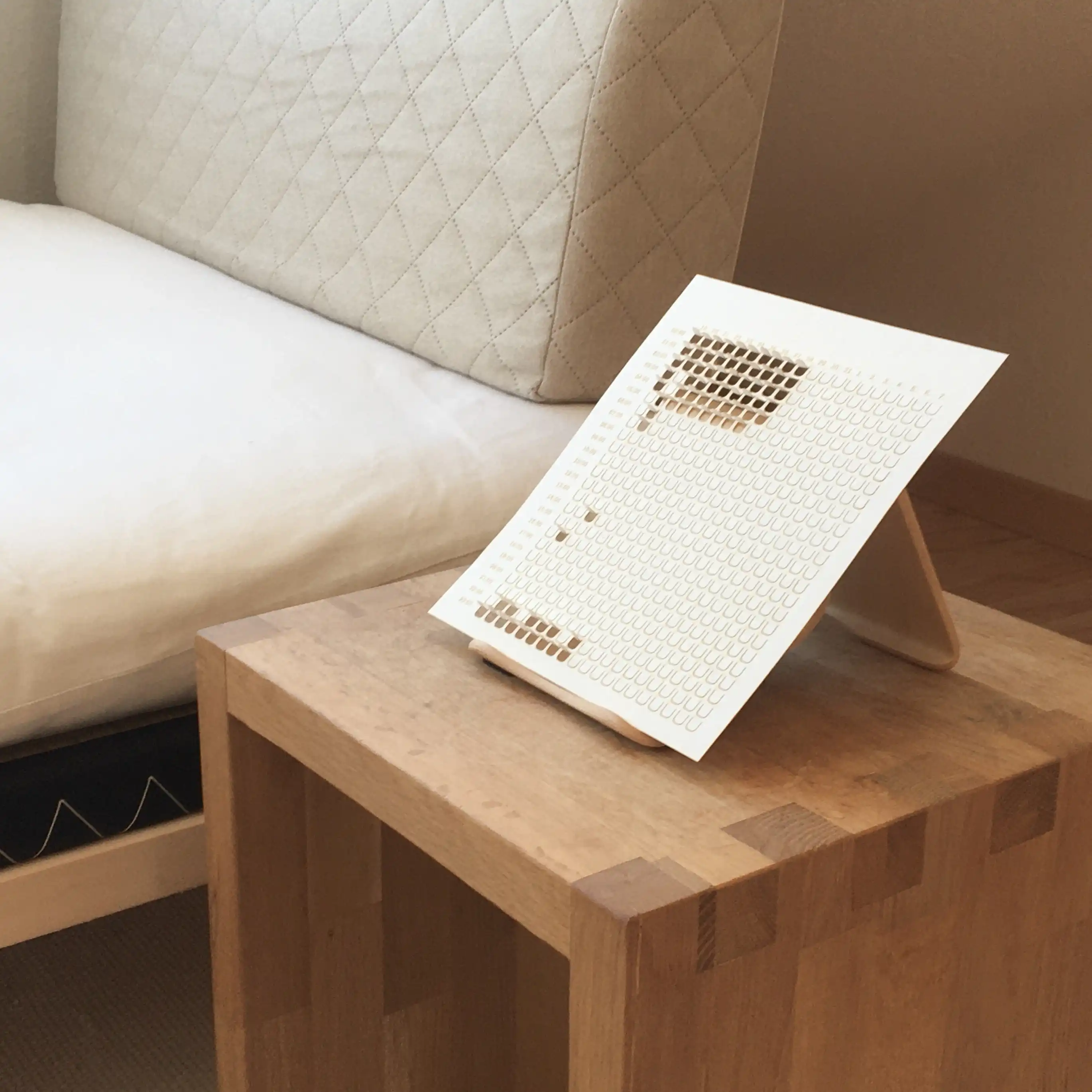 paper sleep tracker on a bed side table